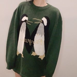 Webster’s dark green knitted sweater